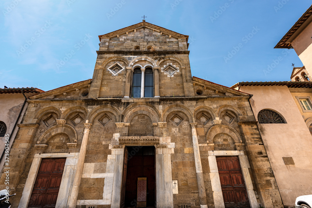 Facade of the Church of San Frediano in Romanesque and Baroque style (XI-XVII Century) in Pisa downtown, Piazza San Frediano, Tuscany, Italy, Europe