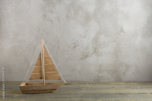 Photography Travel and adventure creative concept - toy wooden boat