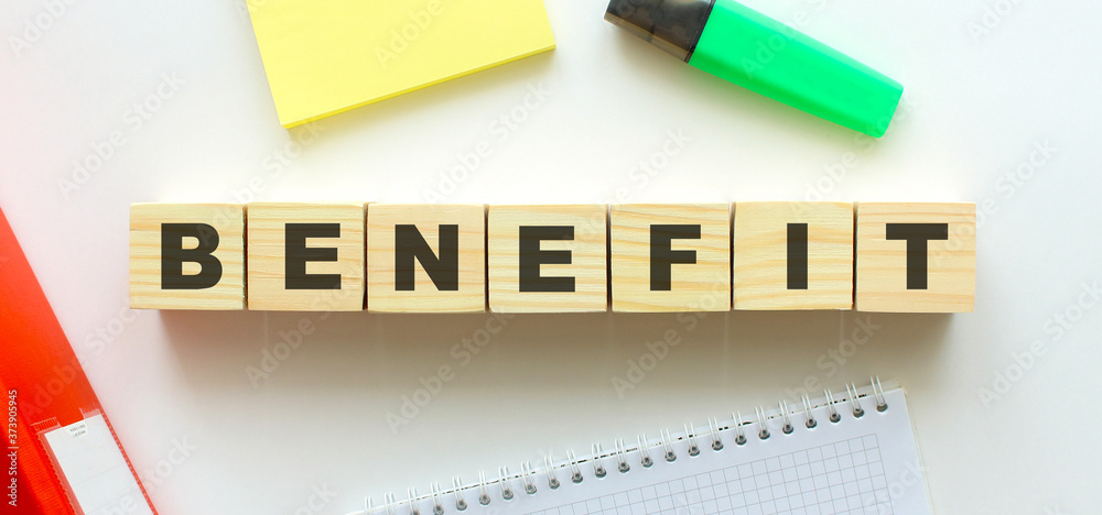 Wooden cubes with word BENEFIT on the office desk. Wooden cubes with word BENEFIT on the office desk.