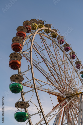 Ferris wheel in the evening light in summer on the banks of the Rhine near Eltville   Germany