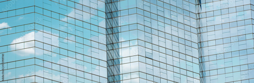 Cloud reflected in windows of modern office building. Cloud reflected in windows of modern office building.