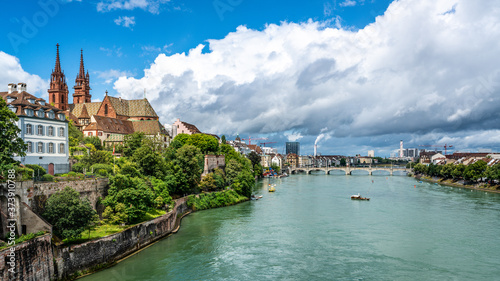 Basel panoramic cityscape with Rhine river view colourful old town and industrial buildings in distance in Basel Switzerland