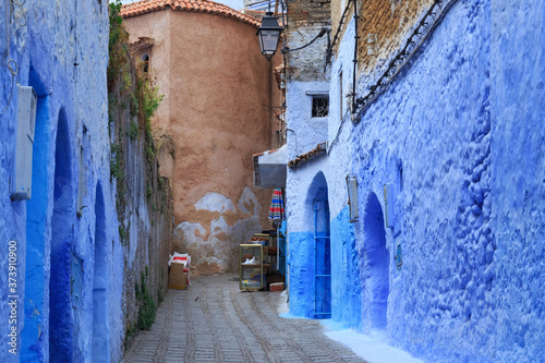 View of the blue walls of Medina quarter in Chefchaouen, Morocco. The city, also known as Chaouen is noted for its buildings in shades of blue and that makes Chefchaouen very attractive to visitors. © Renar