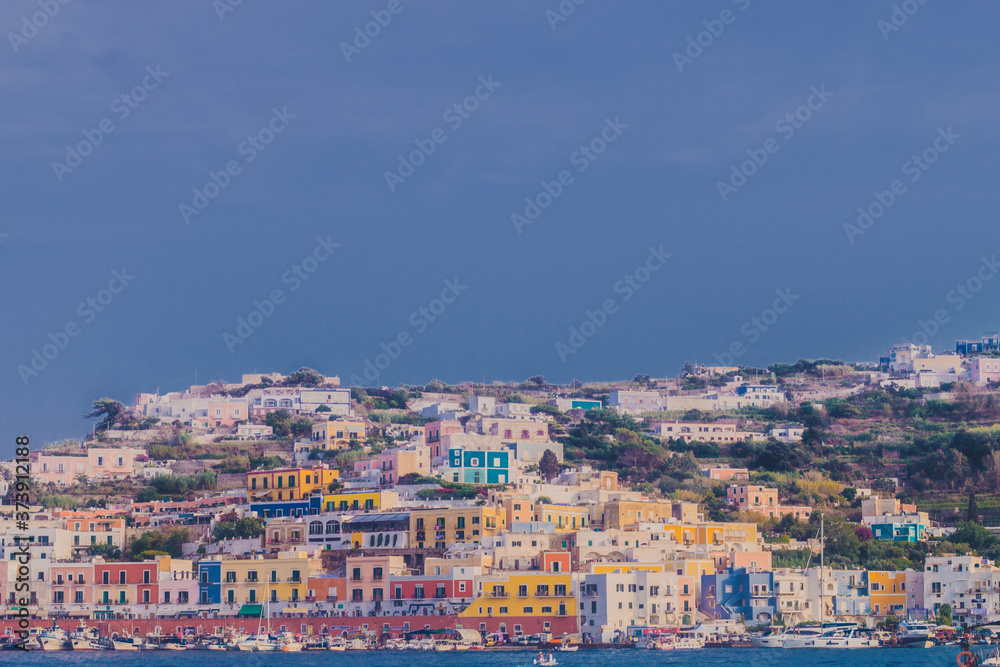 Ponza Island, Italy - 27 July 2019: View of little harbor of Ponza island in the summer season with typical colored houses and boats. Ponza, Italy