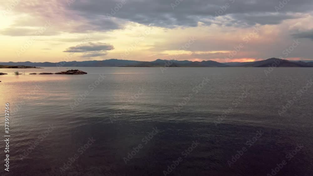 landscape - sunset on the coast, waves, horizon. top view.