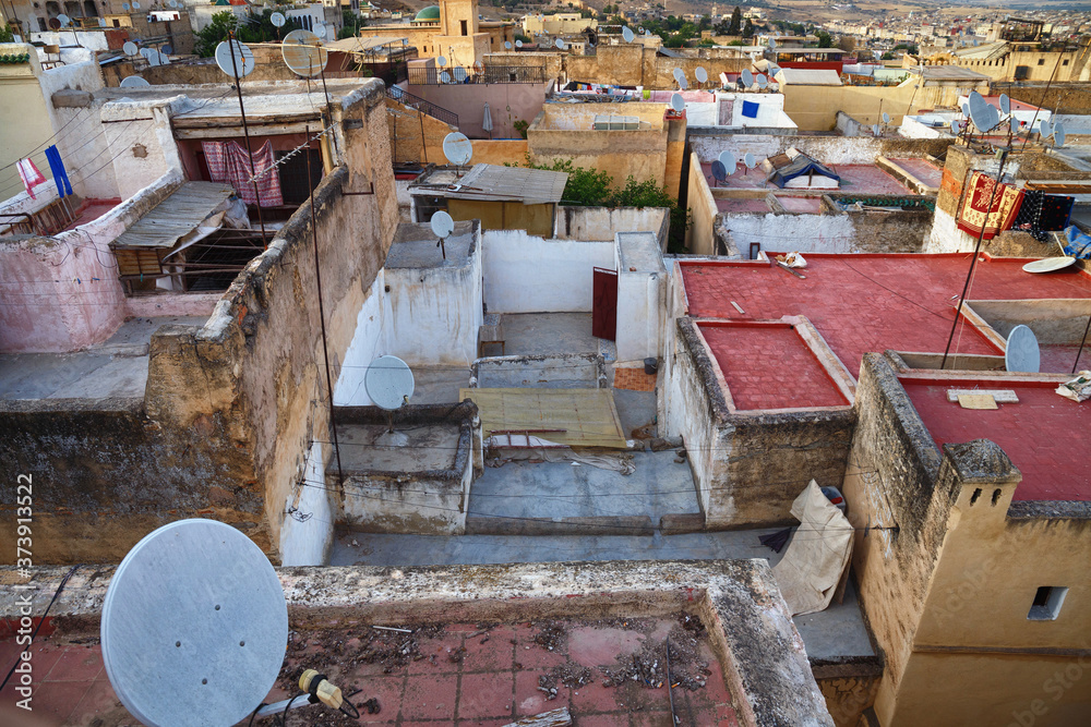 View of the old buildings roofs in medina quarter of Fez in Morocco. The medina of Fez is listed as a World Heritage Site and is believed to be one of the world largest urban pedestrian zones.