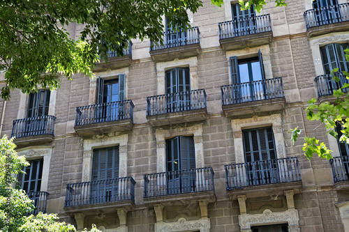 Details of the one of old residential buildings in the historical center of Barcelona in sunny day. Spain.