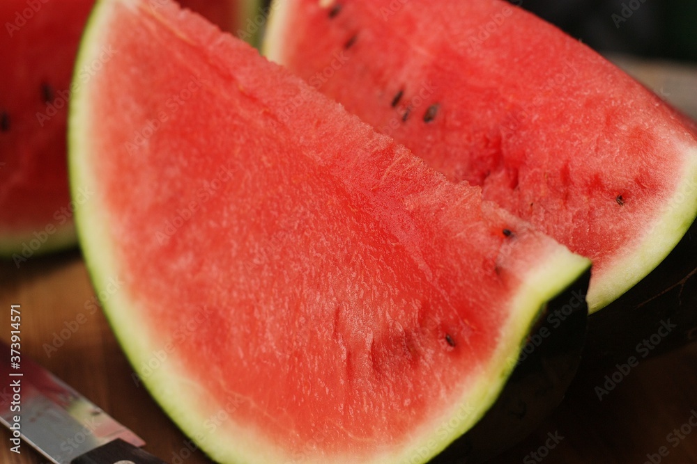 Delicious juicy red watermelon on the table Delicious juicy red watermelon on the table