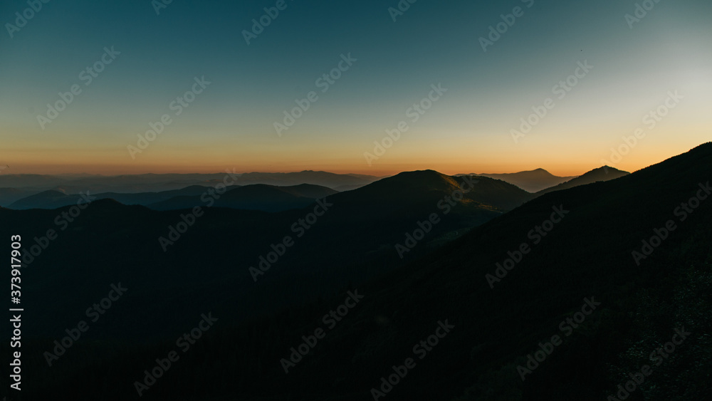 Amazing sunset in the wild ukrainian ridge Marmarosy, near Romania