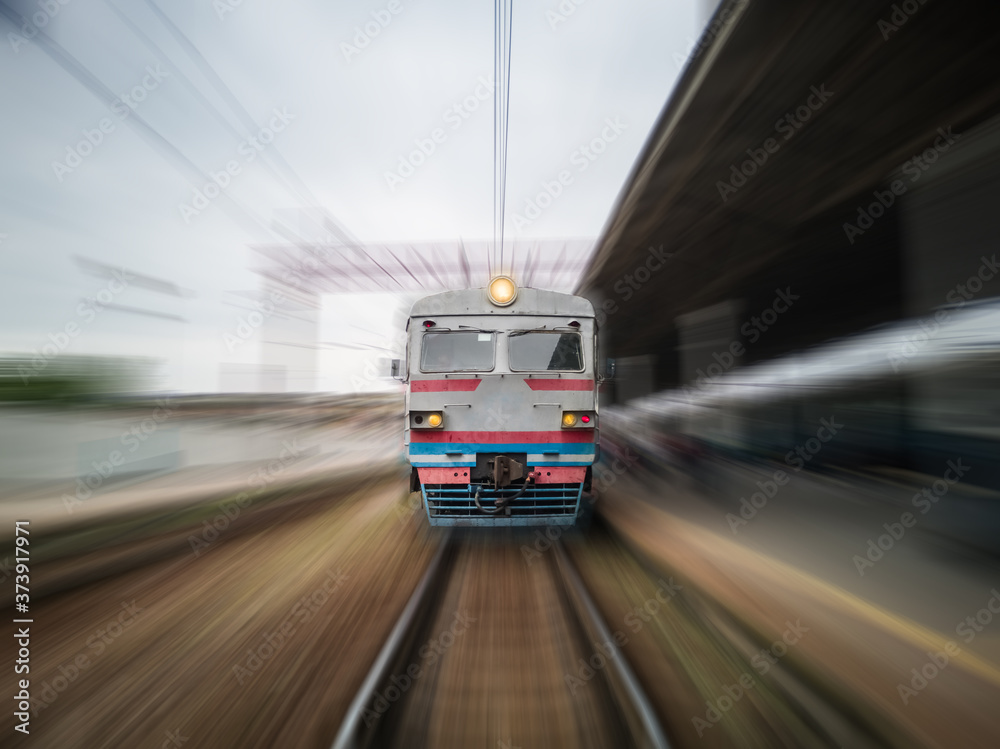 Front view of a moving train with zoom blur.