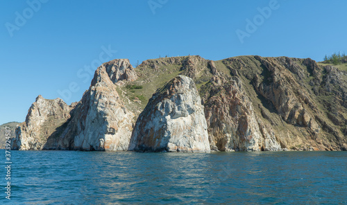 Cape Sagan-Khushun, rocky coast. called as the Cape Three brothers. Three stone peaks symbolizing the three brothers
