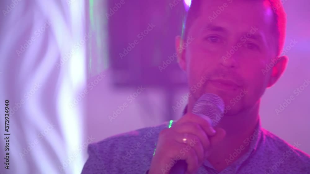 a man with a microphone singing a man with a microphone singing