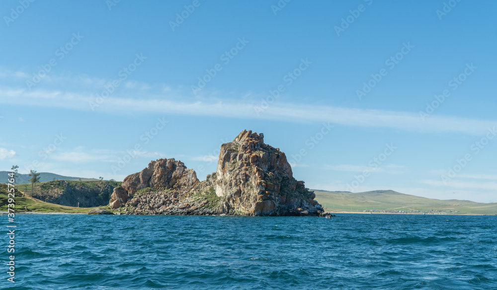 Shamanka Rock on Olkhon. Cape Burhan. Beautiful landscape of Siberian Baikal Lake. concept of travel.