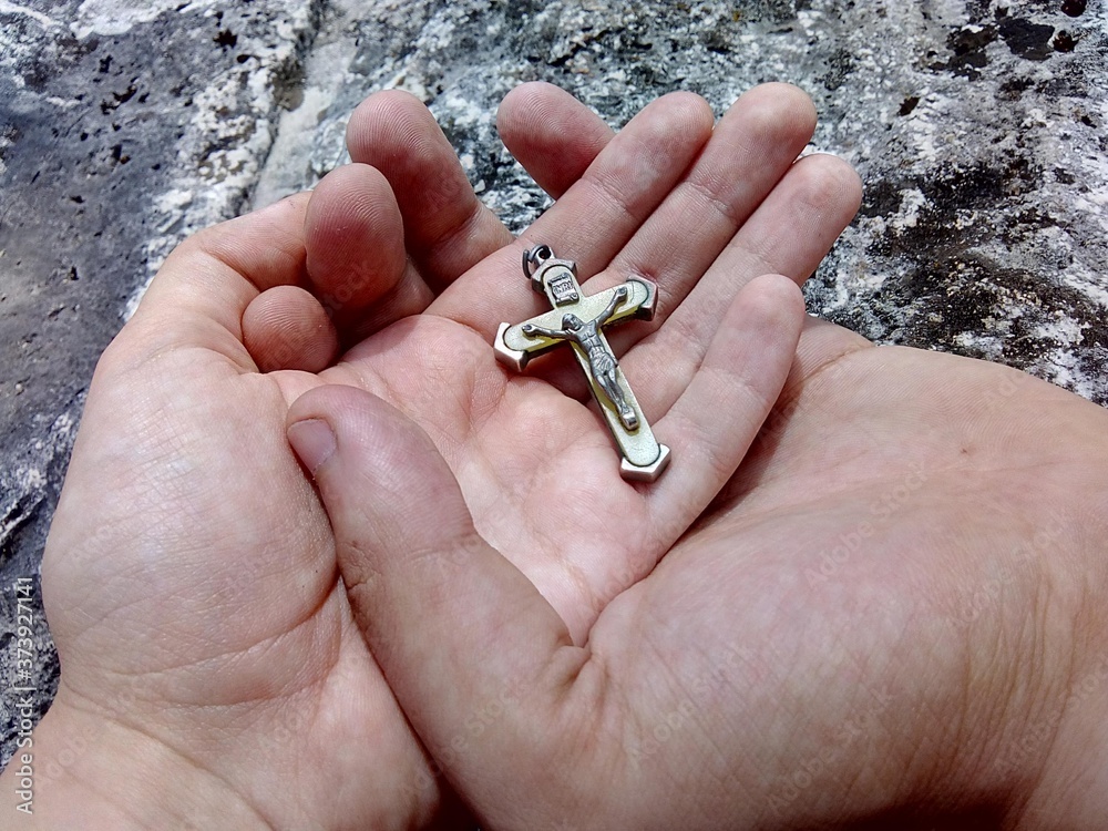 hand with a cross hand with a cross