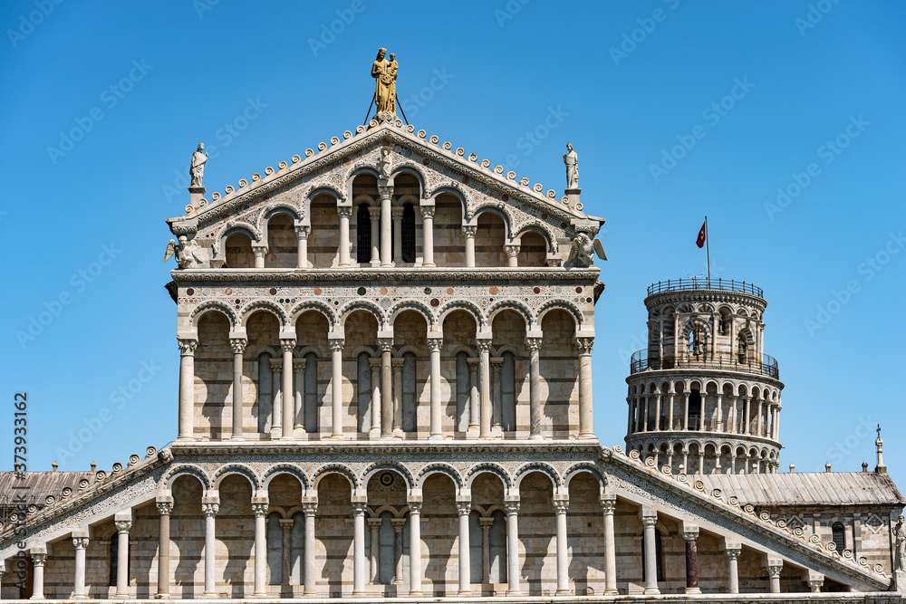 Facade of the Pisa Cathedral (Duomo di Santa Maria Assunta) and the Leaning Tower. Piazza or Campo dei Miracoli (Square of Miracles). Tuscany, Italy, Europe Facade of the Pisa Cathedral (Duomo di Santa Maria Assunta) and the Leaning Tower. Piazza or Campo dei Miracoli (Square of Miracles). Tuscany, Italy, Europe