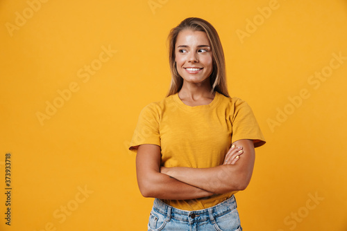Image of blonde joyful woman posing with arms crossed