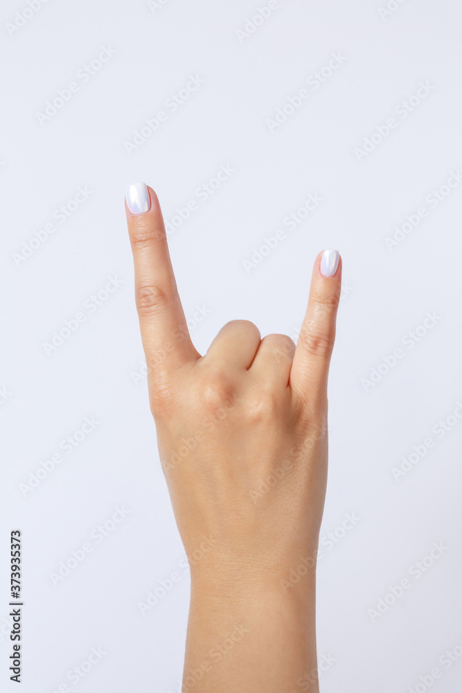 Gesture and sign, hand on a white background. Hand showing rock