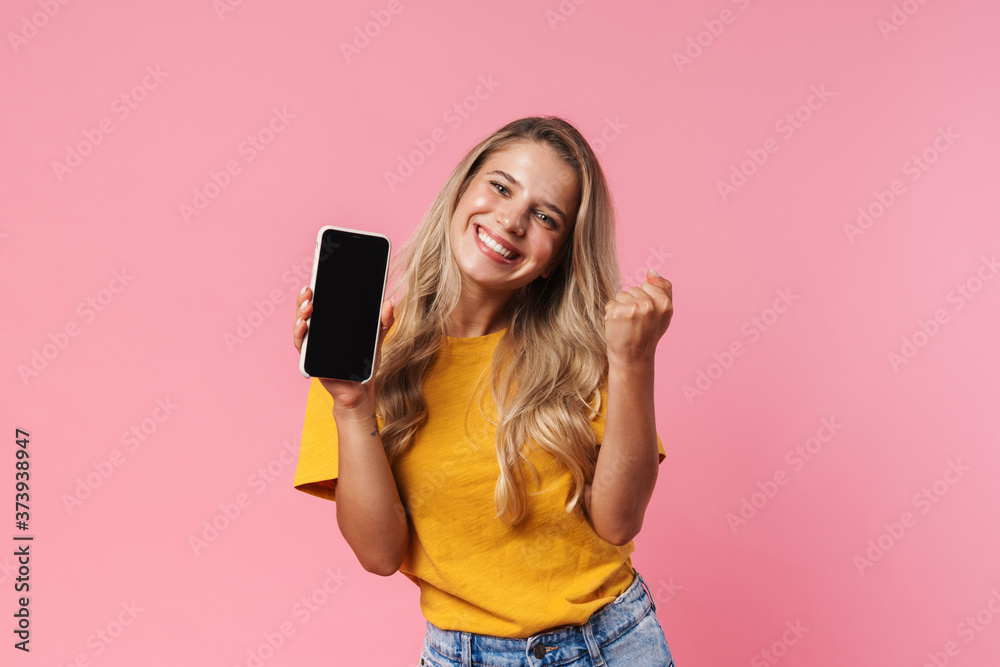 Cheery positive young woman making winner gesture Cheery positive young woman making winner gesture