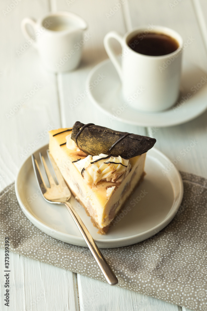 Caramel apple pear cheesecake. Close up side view stone kitchen table, side view. Autumn dessert. Woman decorated apple cake