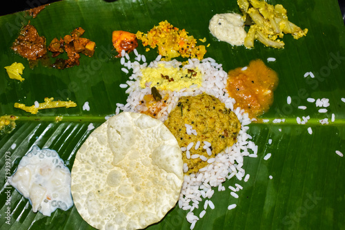 Traditional Onam Sadhya or Onam Feast. Traditional South Indian food served in Banana Leaf. photo
