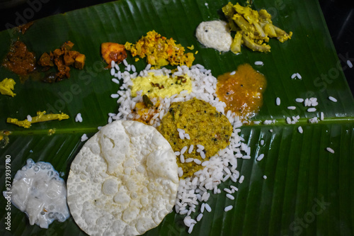 Traditional Onam Sadhya or Onam Feast. Traditional South Indian food served in Banana Leaf. photo