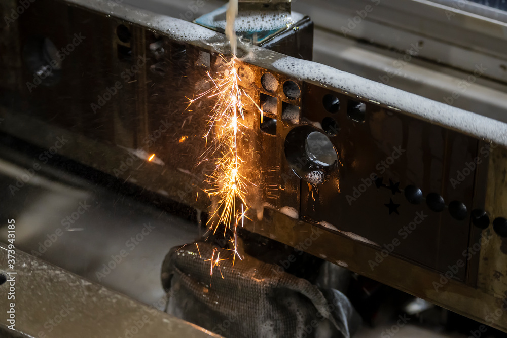 The operation of wireEDM machine cutting the die insert parts. The hi