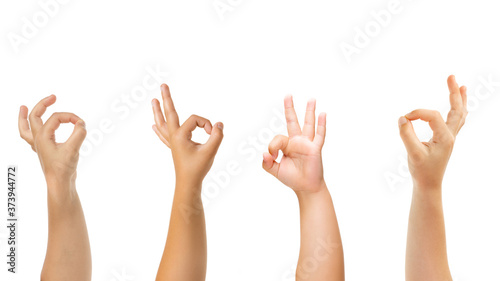 Nice sign. Kids hands gesturing isolated on white studio background, copyspace for ad. Crowd of kids gesturing. Concept of childhood, education, preschool and school time. Signs and senses.