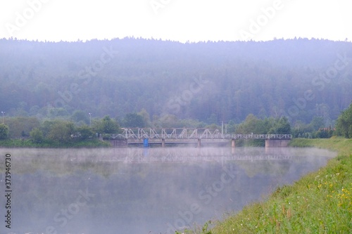 Bridge and dam on Krempna reservoir on magical misty morning. Low Beskids Mountains, Poland © Iwona