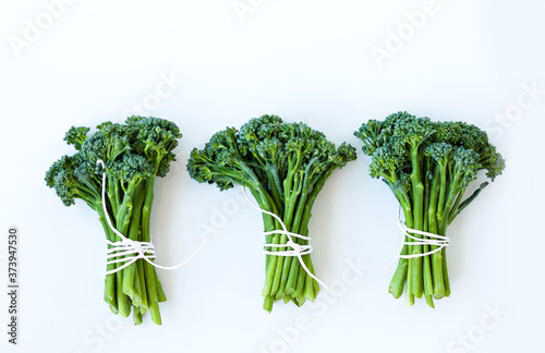 Fresh broccolini isolated on white background with copy space. photo