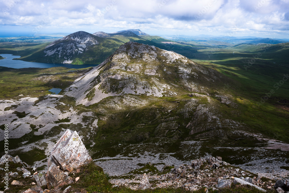 View from the summit of Mount Errigal in the range of Derryveagh Mountains in Glenveagh national park, Donegal, Ireland. View from the summit of Mount Errigal in the range of Derryveagh Mountains in Glenveagh national park, Donegal, Ireland.