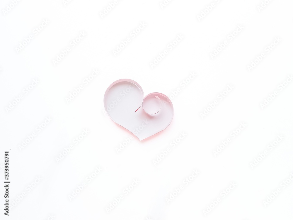 The heart is made of red paper on a white background. Valentine's Day.