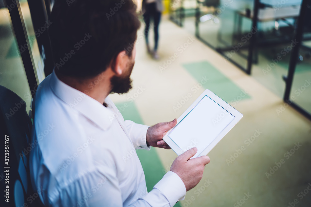 Anonymous businessman using tablet with blank screen Anonymous businessman using tablet with blank screen