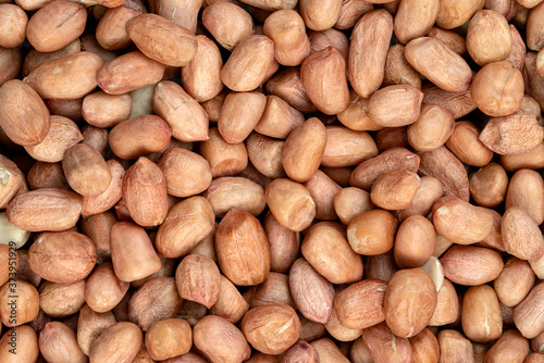 raw peanuts isolated on white background