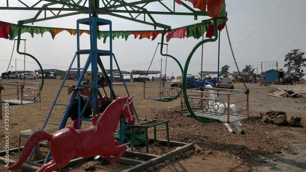 A still deserted Horse Carousal or Merry Go Round at Saputara Gujarat India. This Carousal was situated on top of a mountain land. A still deserted Horse Carousal or Merry Go Round at Saputara Gujarat India. This Carousal was situated on top of a mountain land.