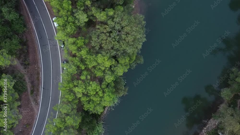 aerial video of drone with water trees and roads