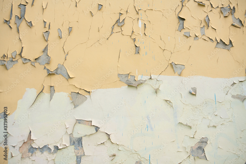 Fototapeta premium wall with yellow old peeling paint