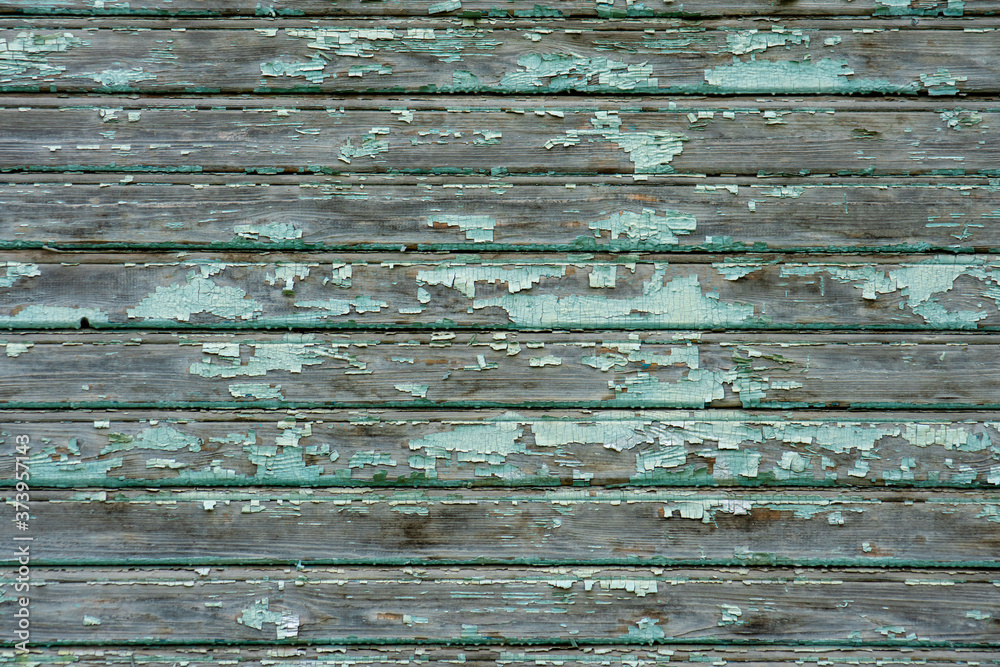 Obraz premium wooden background with old green paint. peeling green paint as background