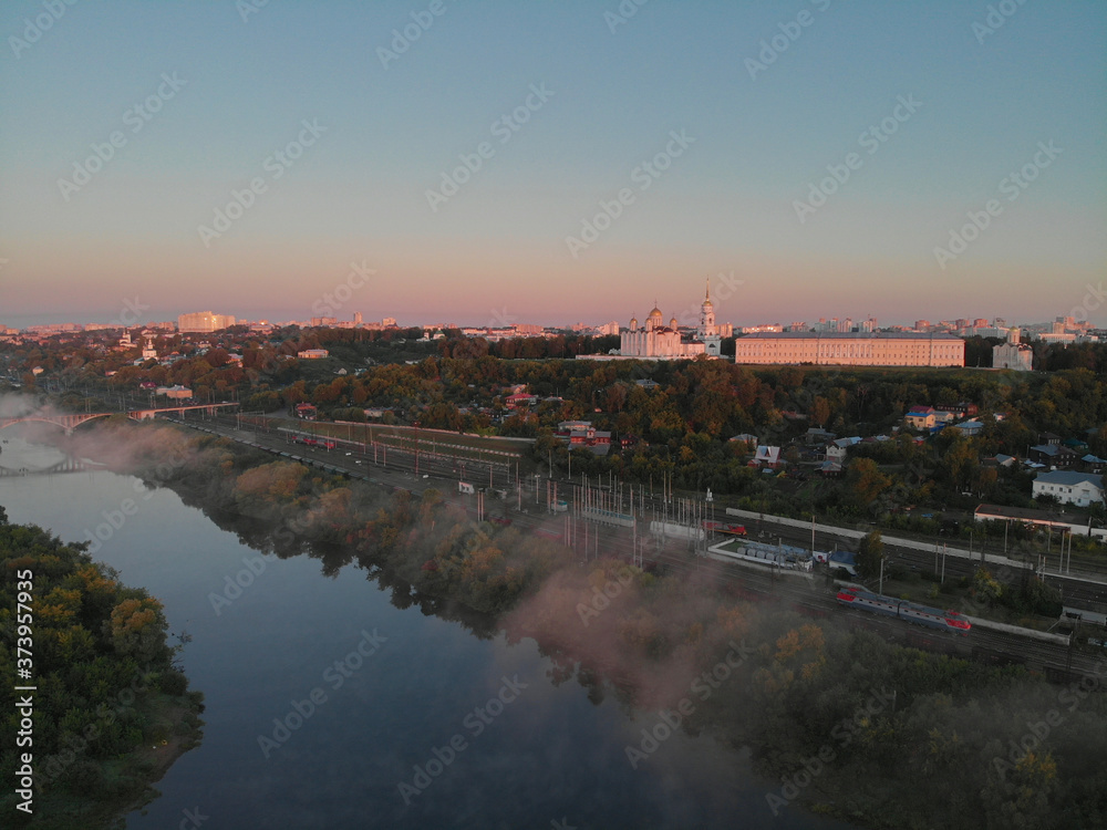 Aerial view to the river Klyazma and center of Vladimir, Russia. Photographed on drone at dawn. UNESCO world heritage.