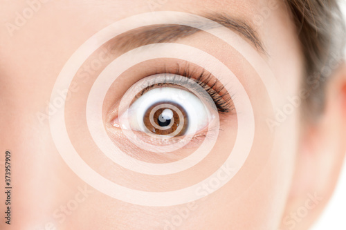 Hypnosis spiral over Asian woman face of hypnotized girl portrait background.