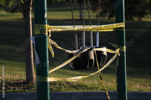 Closed swings on playground for social distancing