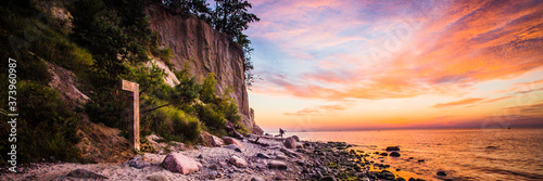 Amazing colorful sunrise over the pier in Gdynia Orlowo. Panoramic banner