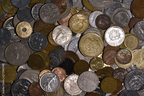 Cenital view of a pile of world coins