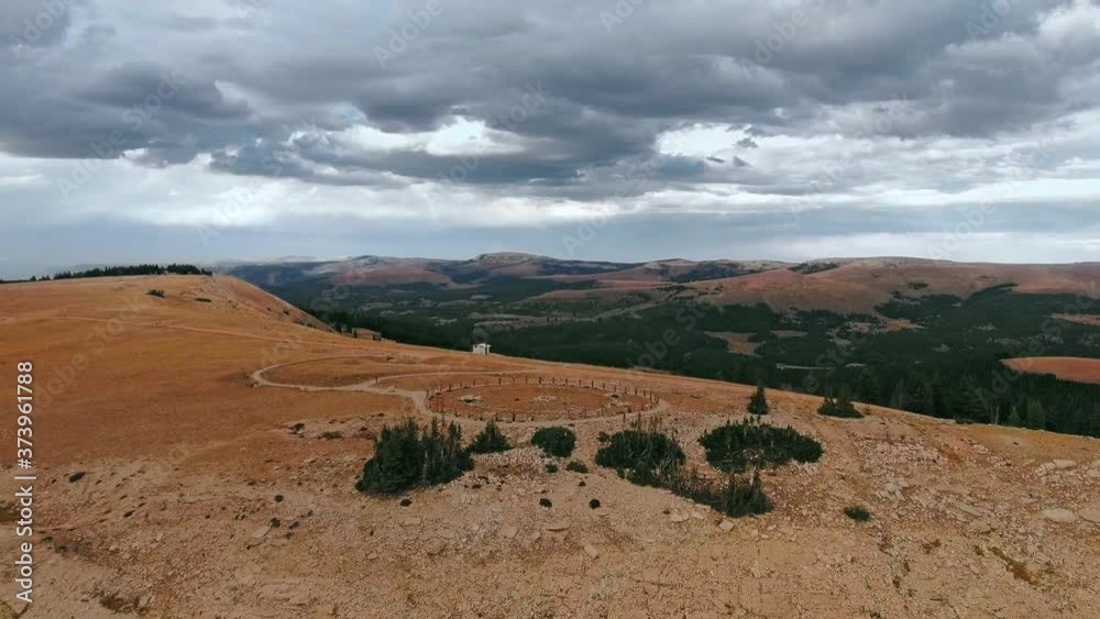 Drone circling over the plateau with ruins of Bighorn Medicine Wheel in Wyoming, USA Drone circling over the plateau with ruins of Bighorn Medicine Wheel in Wyoming, USA