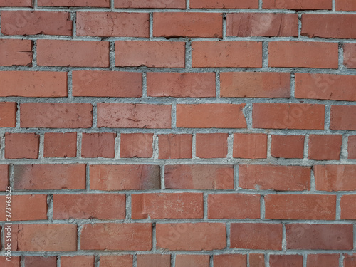 The texture of the outer part of the brick wall is red. Architecture, structure.