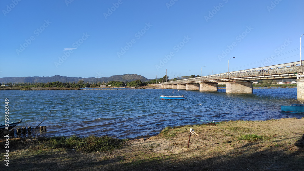 The Fao metallic bridge, known as D. Luís Filipe Bridge. It is located at Fao in Braga District, crossing the Cávado River. The riverside promenade.
