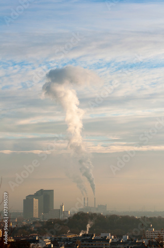 Industrial chimneys bellowing out smoke in Munich, Germany. 