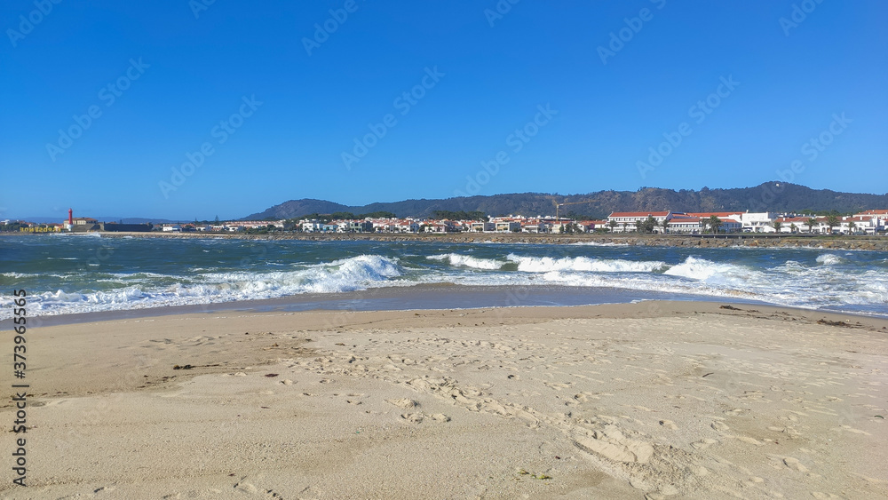 Waves of water of the river and the sea meet each other during high tide and low tide. Whirlpools of the Cavado River in Esposende, Portugal.