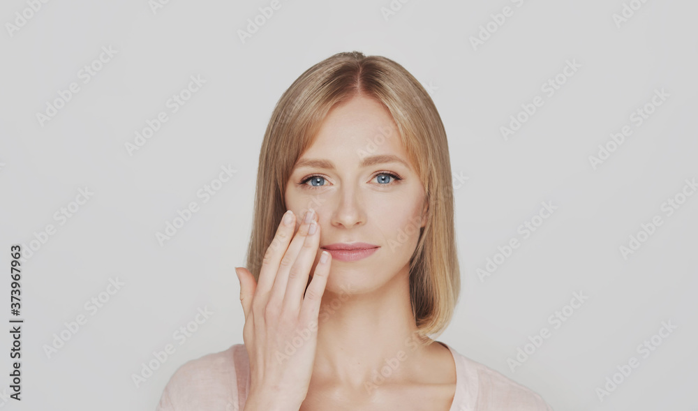 Studio portrait of young, beautiful and natural blond woman. Studio portrait of young, beautiful and natural blond woman.