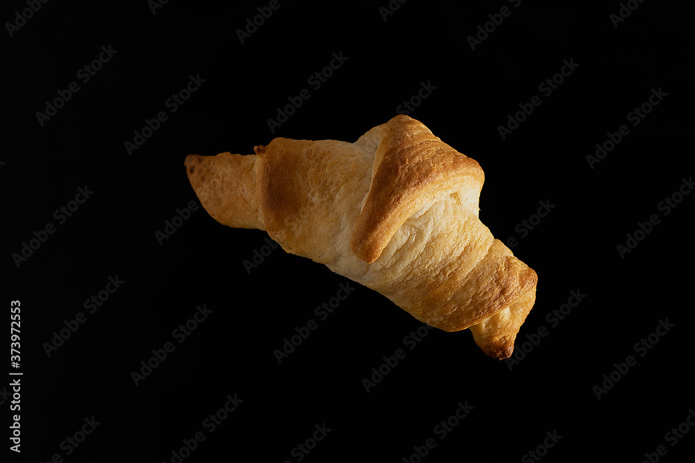 croissant on black background