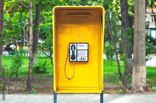 close up of the public pay phone in the city